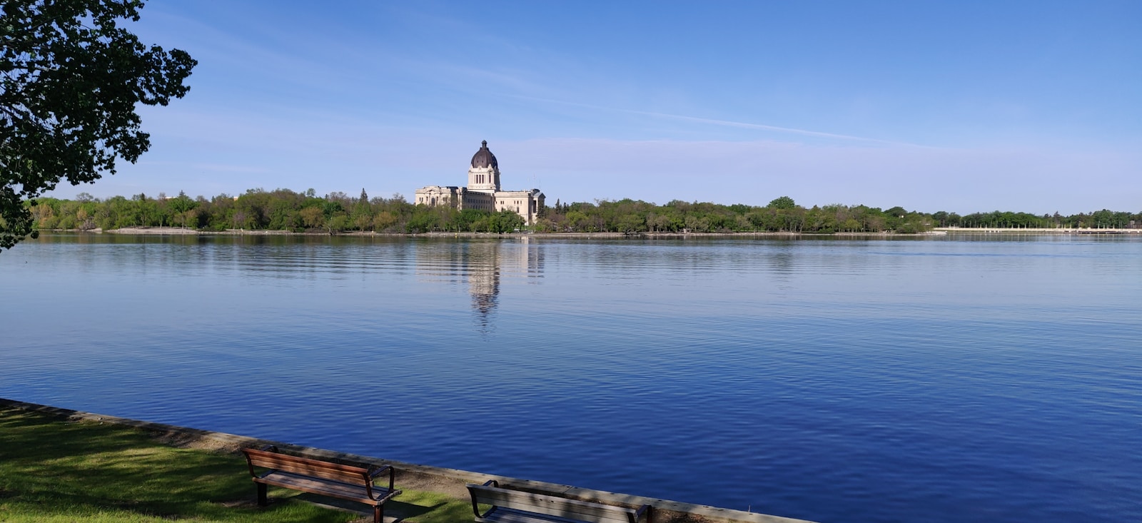 Wascana Lake shoreline path with prairie skyline